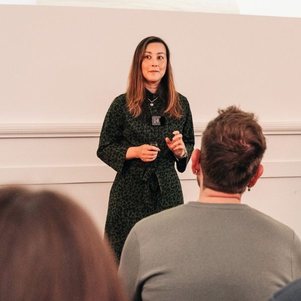 Female client delivering a confident presentation during Project Charisma 1-to-1 public speaking coaching workshop in ManchesterA client of Project Charisma’s 1-to-1 public speaking coaching programme confidently presenting to a group during a live workshop in Manchester.
