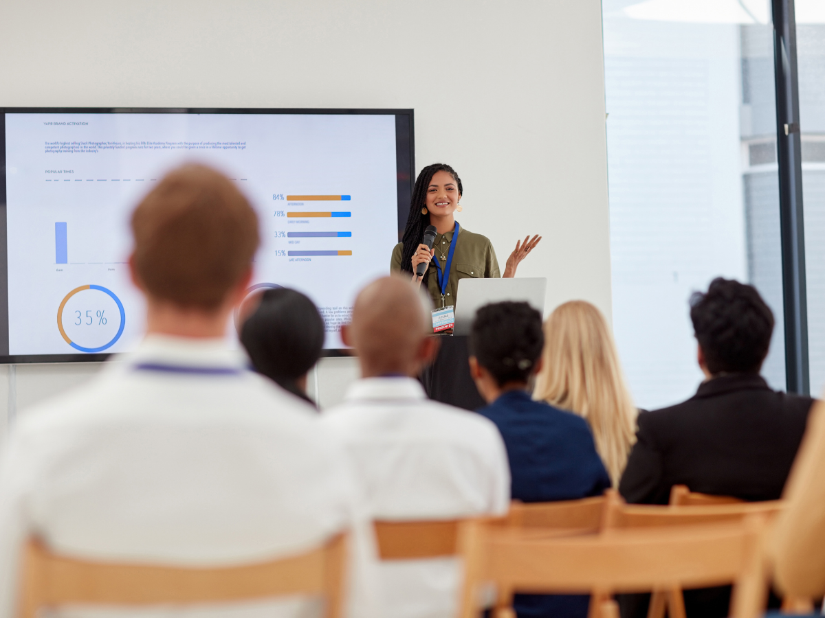 Woman practises communication skills to an audience