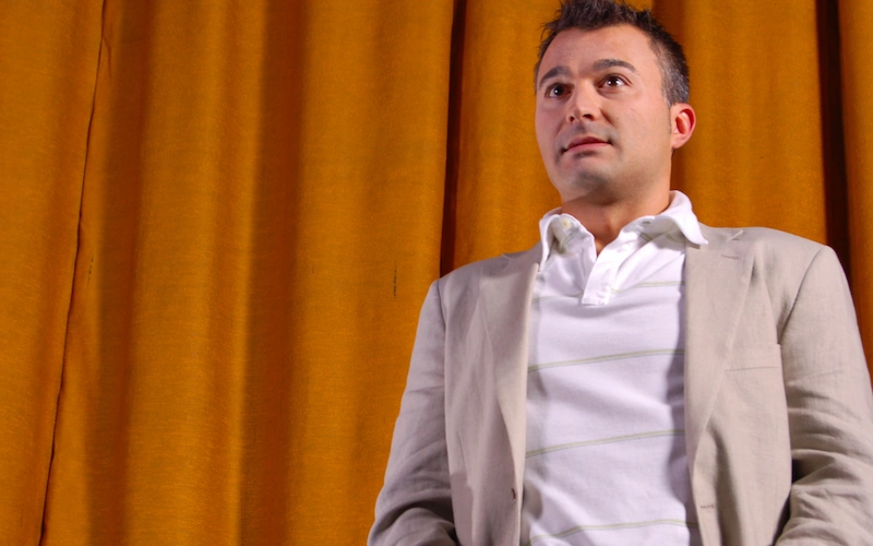 Nervous man about to speak on stage experiencing public speaking anxiety
