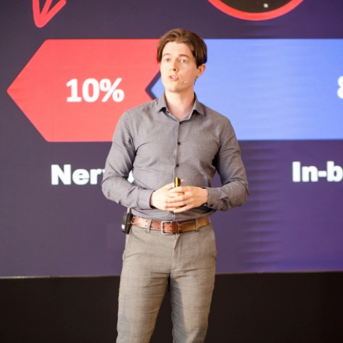 Ed Darling delivering his keynote talk on Speaking with Impact to an audience of professionals during a corporate public speaking training event