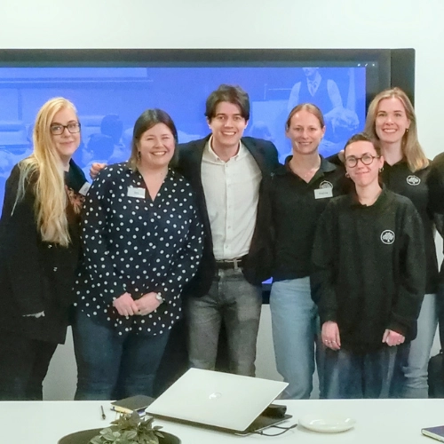 Ed Darling posing for a group photo with the Mulberry team at their Rookery head office after completing a corporate public speaking team training session