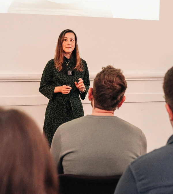 Female client delivering a confident presentation during Project Charisma 1-to-1 public speaking coaching workshop in Manchester