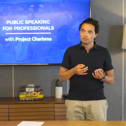Laurence, orthodontist, delivering a confident speech during Project Charisma’s 1-Day Public Speaking Masterclass, preparing for a large industry conference