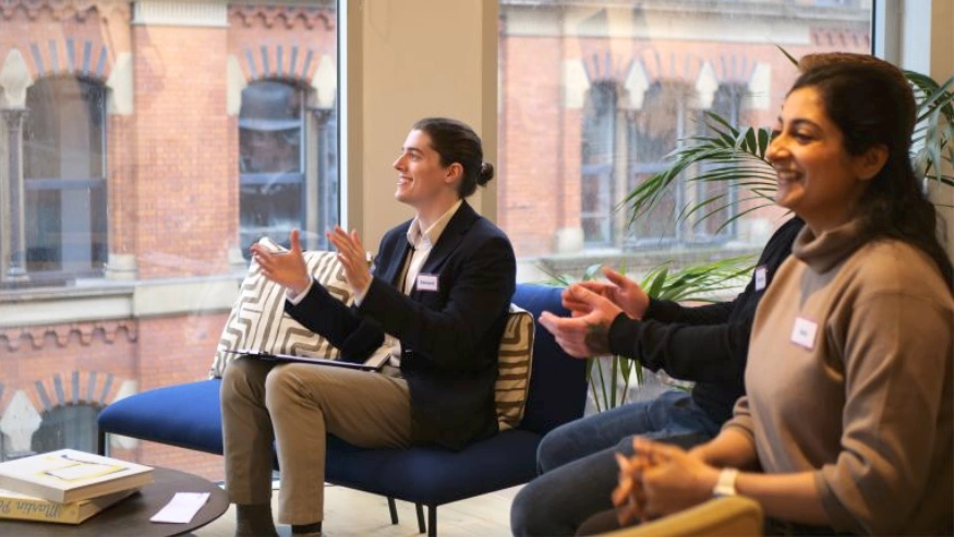 Group of professionals clapping and smiling as a participant delivers an improvised speech during Project Charisma’s 1-Day Speak & Present Masterclass